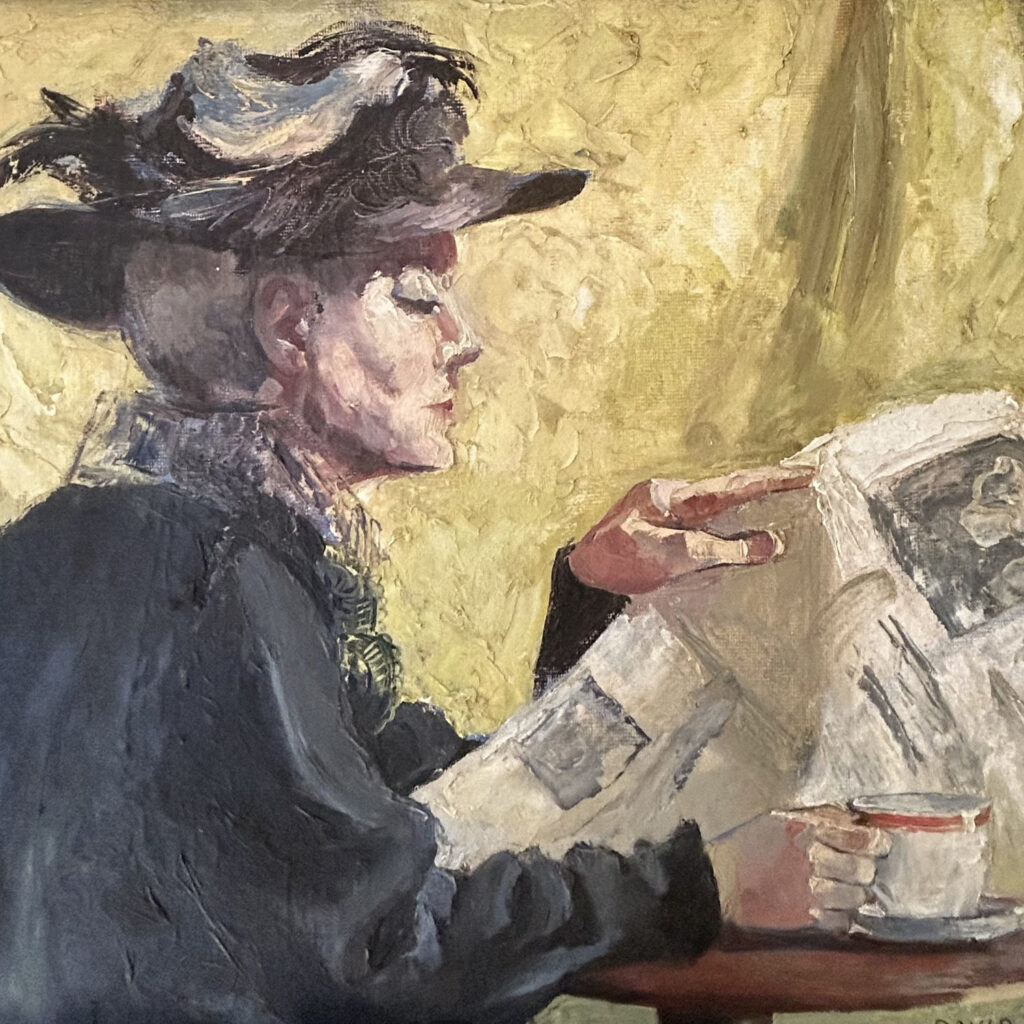 Woman reading a newspaper